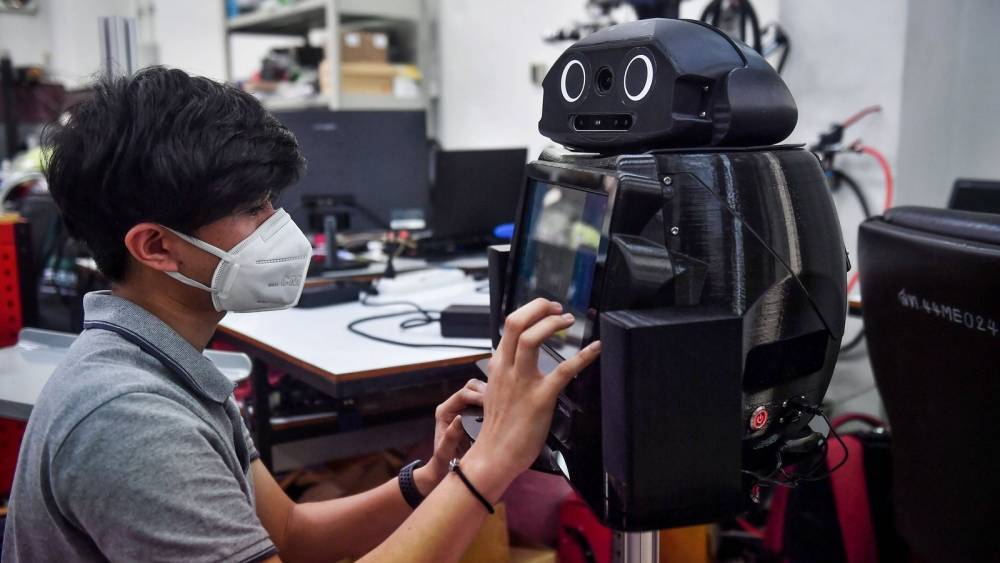 Thai hospitals deploy 'ninja robots' to aid virus battle - rte.ie - Thailand - city Bangkok