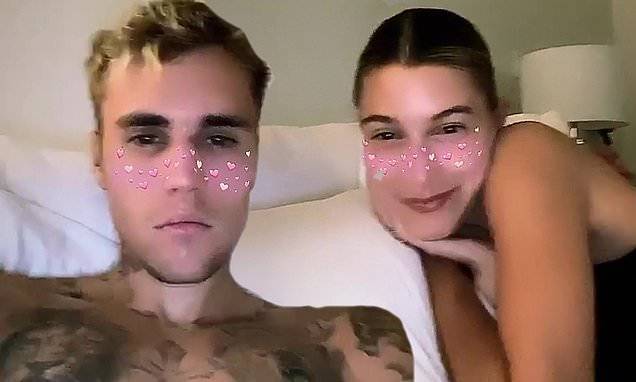 Justin Bieber - Christopher Nolan - Heath Ledger - Justin Bieber goes shirtless as he and wife Hailey watch Dark Knight while enjoying social isolation - dailymail.co.uk