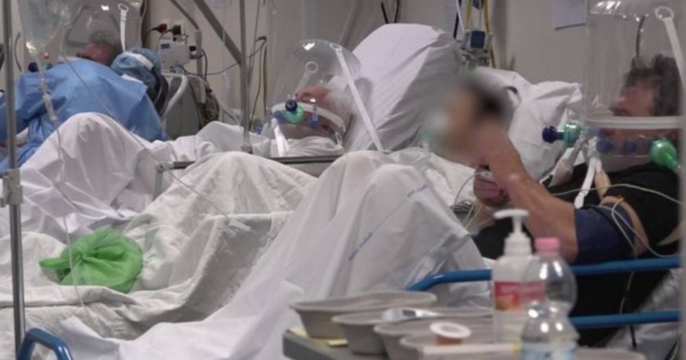 Coronavirus patients wear plastic helmets in intensive care at Italian hospital - dailyrecord.co.uk - China - Italy - Britain