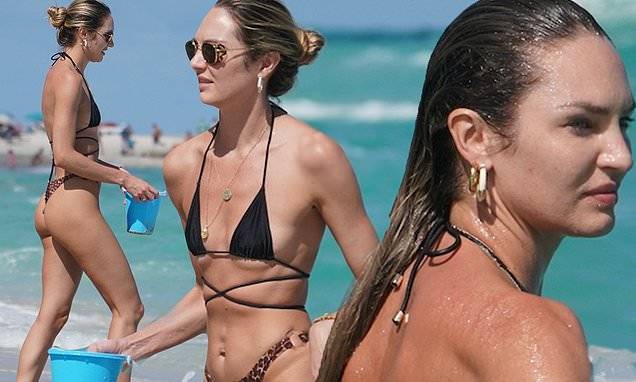 Candice Swanepoel sports a tiny bikini and looks carefree with her sons at the beach in Miami - dailymail.co.uk - county Miami - South Africa