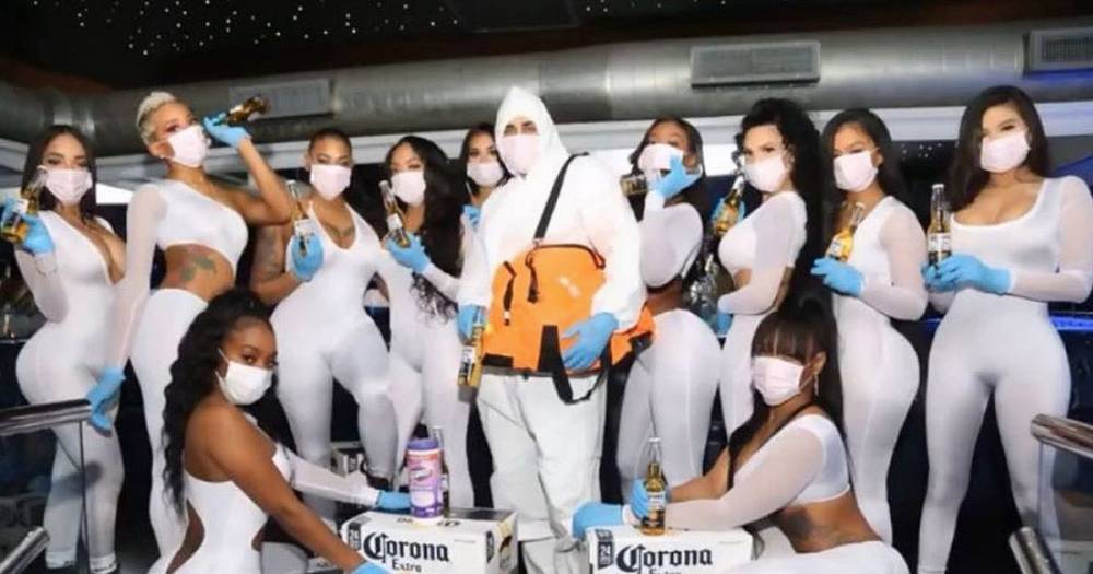 Strip club hosts saucy coronavirus party with babes in hazmat suits that peel off easily - dailystar.co.uk - Usa - New York, Usa