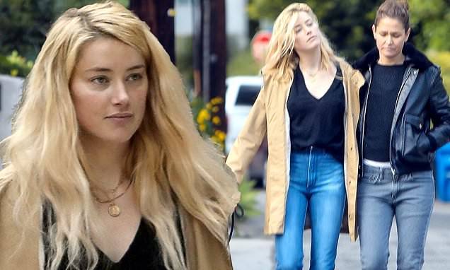 Amber Heard - Amber Heard puts her arm around Bianca Butti as they take a self-isolation break to walk her dog - dailymail.co.uk - Los Angeles - city Los Angeles