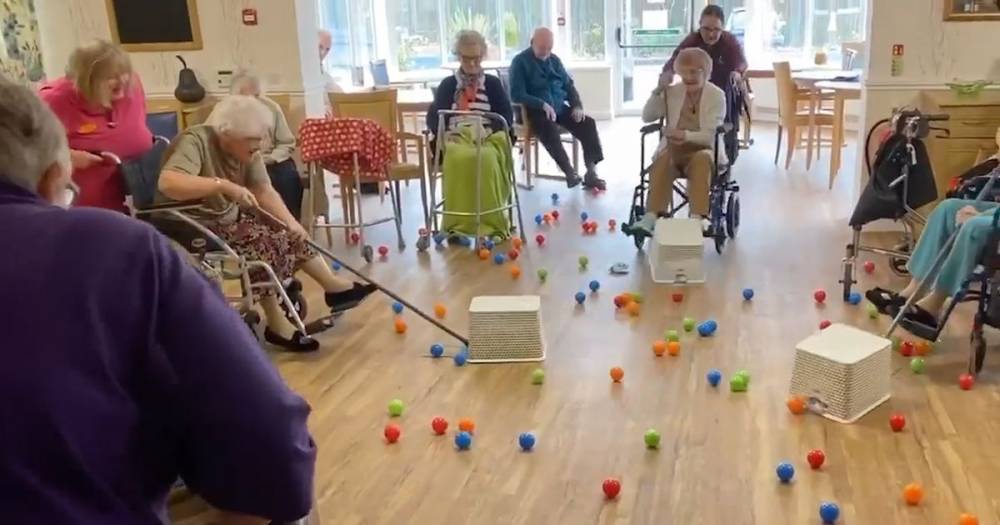 Care home residents in coronavirus lockdown play real-life Hungry Hippos game - mirror.co.uk