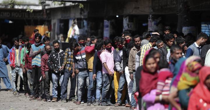 Narendra Modi - Coronavirus: Indian migrant workers defying COVID-19 curfew, crowd trains - globalnews.ca - city New Delhi - India