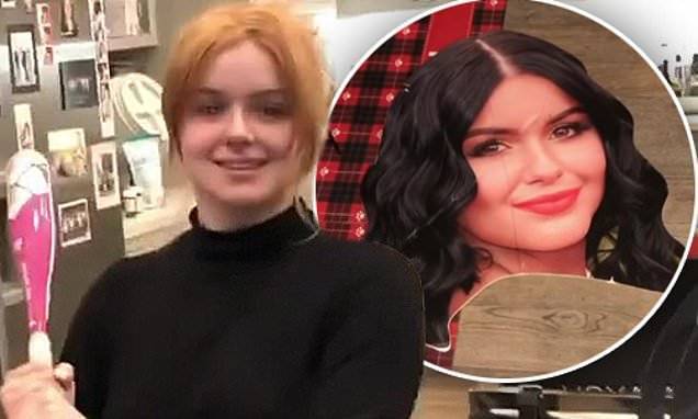 Ariel Winter - Ariel Winter takes a baseball bat to a cardboard cut-out of her face while cleaning her house - dailymail.co.uk