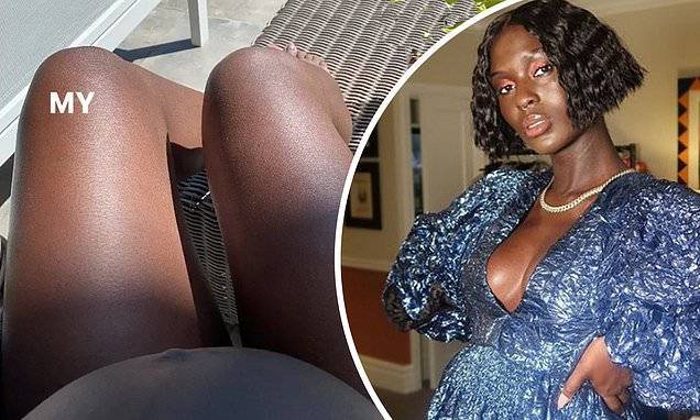 Jodie Turner-Smith flashes her burgeoning baby bump during self-isolating day by the pool - dailymail.co.uk