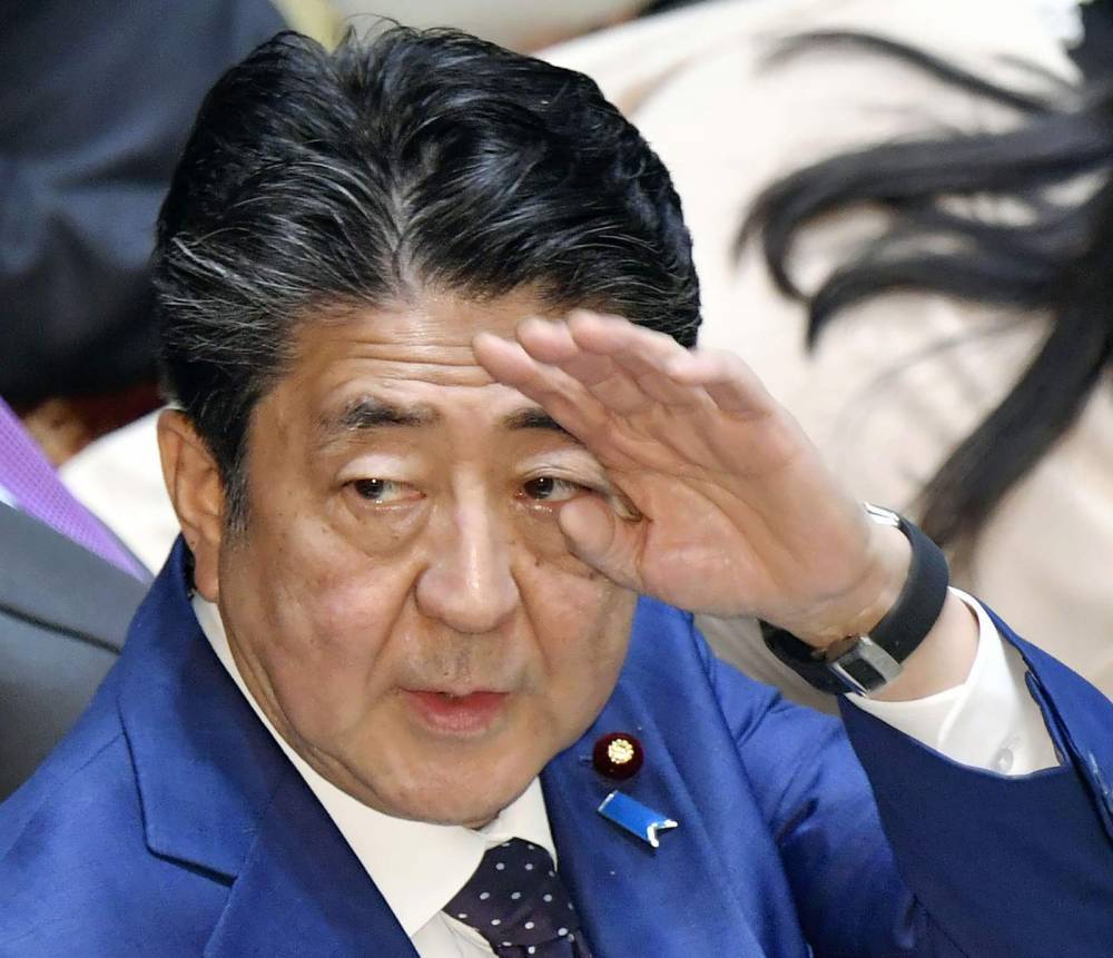 Shinzo Abe - The Latest: Japan to begin quarantining all visiting from US - clickorlando.com - China - Philippines - Japan - Usa - Pakistan - city Tokyo