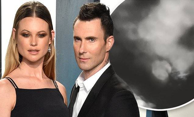 Behati Prinsloo reveals she is NOT pregnant after her daughter accidentally posts a photo - dailymail.co.uk