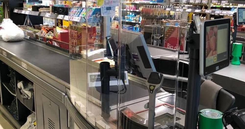 Christian Härtnagel - Lidl fitting cough and sneeze proof checkout protection screens in all stores - dailyrecord.co.uk - Britain
