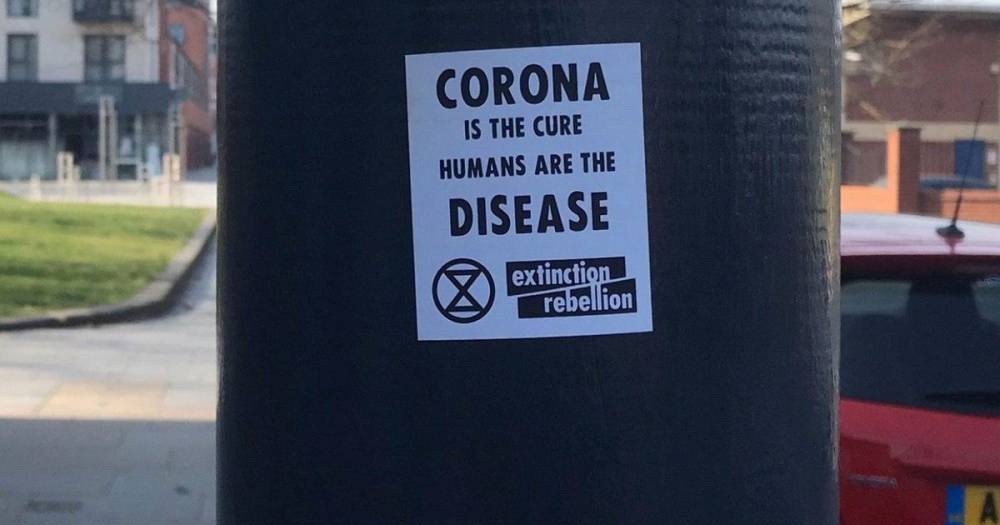 Coronavirus: 'Extinction Rebellion' posters appear calling 'humans the disease' - dailystar.co.uk - Britain