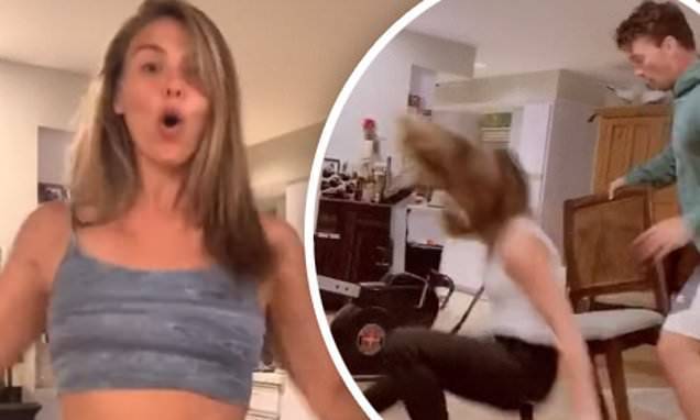Hannah Brown - Hannah Brown tumbles to the floor after losing game of musical chairs to Tyler Cameron - dailymail.co.uk - county Tyler - parish Cameron