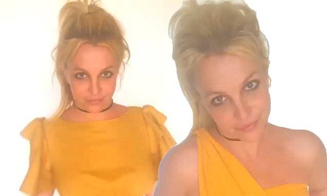 Britney Spears dons yellow and insists she was JOKING when claiming to beat Usain Bolt's 100 meter - dailymail.co.uk
