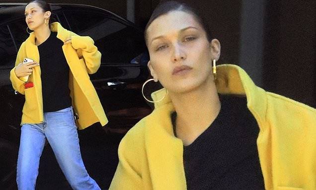 Bella Hadid - Gigi Hadid - Bella Hadid stands out in bright yellow jacket with jeans while stepping out to pick up food in LA - dailymail.co.uk - Los Angeles - city Los Angeles