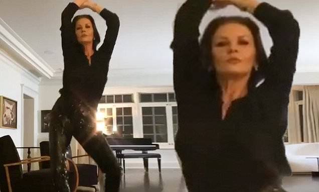 Michael Douglas - Catherine Zeta-Jones shows off her slender stems in sequin slacks while enjoying a solo dance - dailymail.co.uk - county Douglas