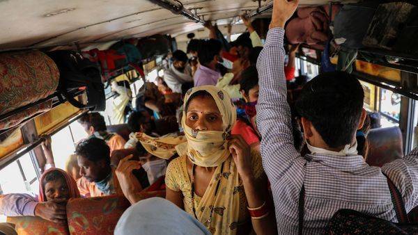 See pics: Amid lockdown, UP govt arranges special buses for scores of migrants - livemint.com - city Delhi