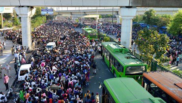 In pics: Thousands of migrants throng to take govt-organised buses for hometowns - livemint.com - city New Delhi - city Delhi