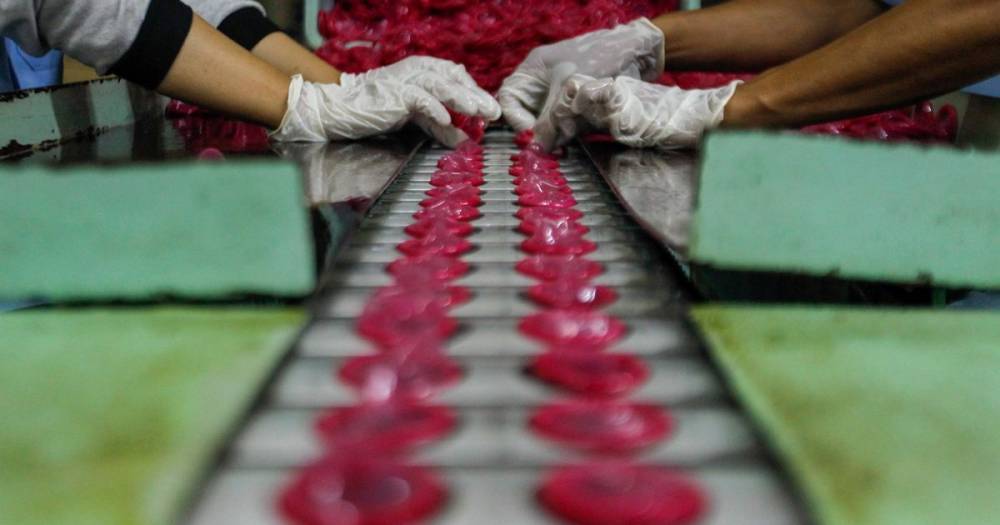 Coronavirus: World facing condom shortage as lockdown stops production of 100 million - mirror.co.uk - Britain - Malaysia