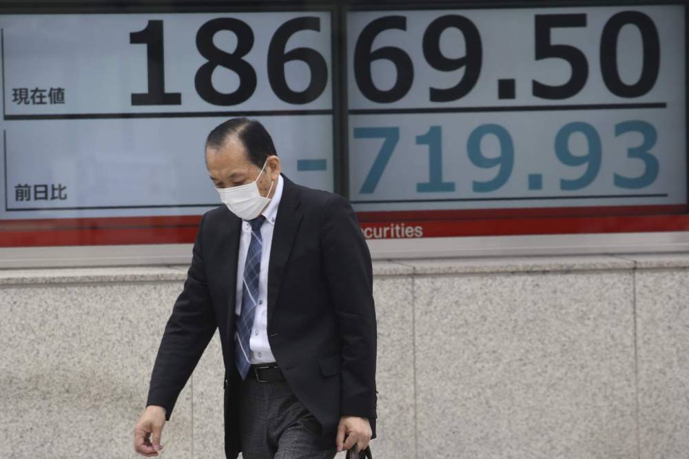 Asian shares extend losses as toll from pandemic surges - clickorlando.com - Japan - Australia - city Bangkok