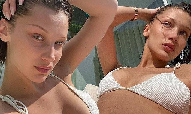 Bella Hadid - Bella Hadid flaunts her taut figure in white bikini as she catches some sun during self-quarantine - dailymail.co.uk