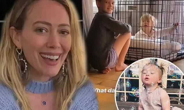 Hilary Duff - Matthew Koma - Hilary Duff's daughter Banks, one, blows bubbles before brother Luca, eight, locks her in dog crate - dailymail.co.uk