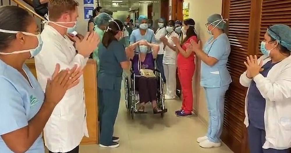 British coronavirus survivor, 85, cheered by staff as she leaves hospital - mirror.co.uk - Britain - Colombia