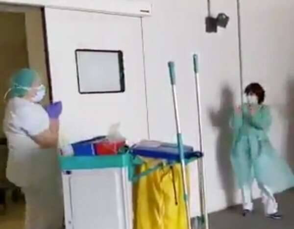 Watch Healthcare Workers Applaud Cleaning Staff for Their Hard Work in Heartwarming Video - eonline.com