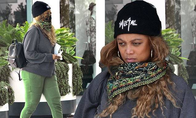 Tyra Banks, 46, covers up in a 'Smize 4 Me' beanie and colorful scarf as she runs errands in LA - dailymail.co.uk - Los Angeles - city Los Angeles
