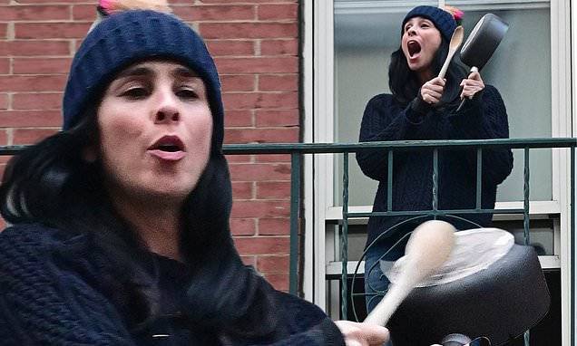 Sarah Silverman dons a playful beanie as she cheers on essential workers in NYC from her balcony - dailymail.co.uk - city New York