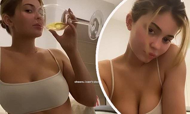 Kylie Jenner - Kylie Jenner sips wine and gazes at herself while wearing a skimpy bralette - dailymail.co.uk