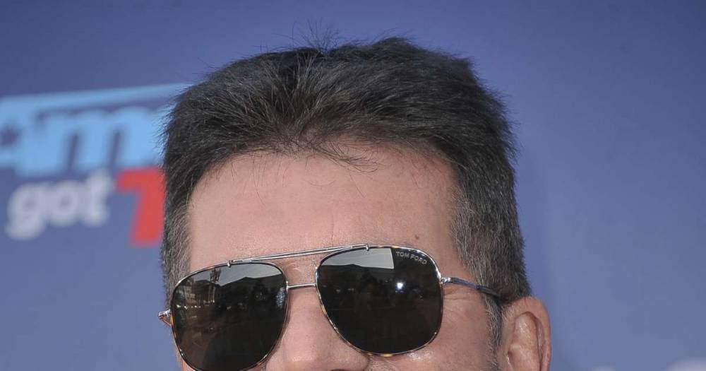 Simon Cowell - Simon Cowell reveals health fears for son Eric in rare interview about family life - msn.com - Britain