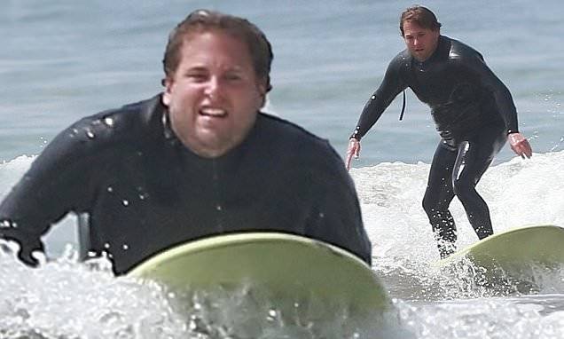 Jonah Hill shows off trim figure in wetsuit as he emerges from lockdown to surf in Santa Barbara - dailymail.co.uk - state California - county Hill - city Manhattan - city Santa Monica - county Los Angeles - county Santa Barbara