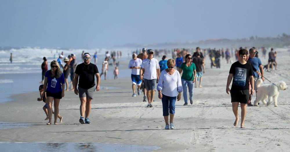 Beach packed 30 minutes after reopening despite record rise in coronavirus cases - mirror.co.uk - state Florida