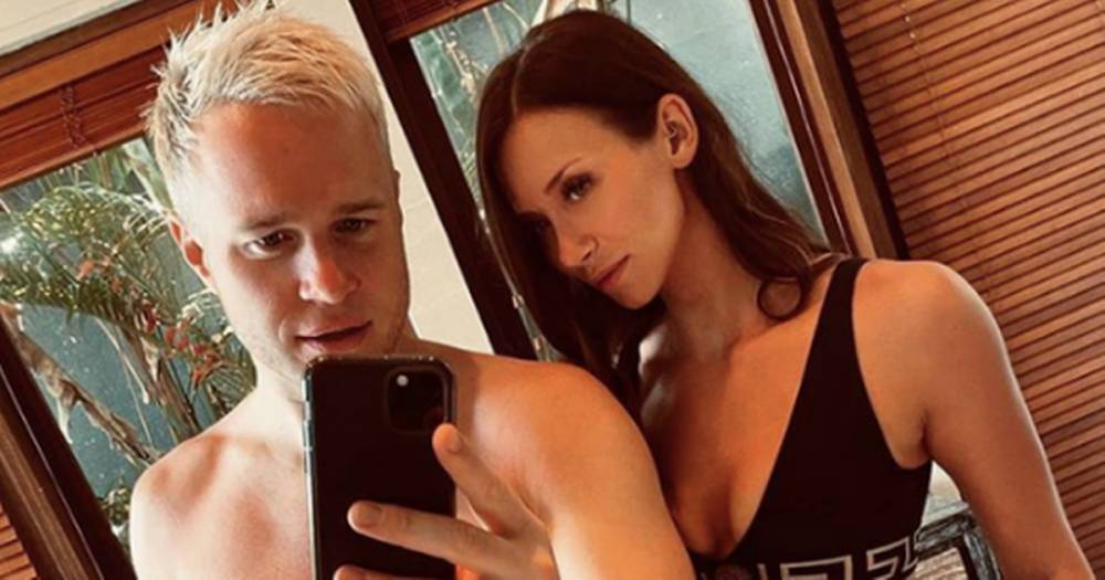 Olly Murs' girlfriend Amelia Tank shows off incredible strength by holding his entire bodyweight as he sips wine - ok.co.uk