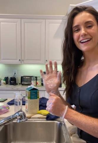 Nina Dobrev - Nina Dobrev Washes Her Groceries In Hilarious Video With The Help Of A Mystery Man - etcanada.com