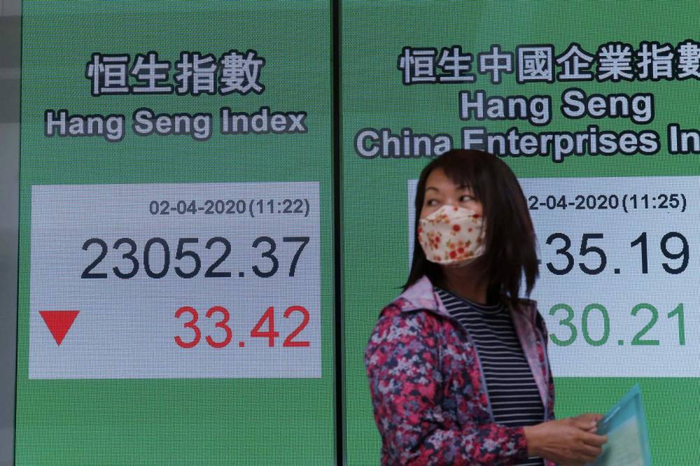 Asian stocks mixed as economic toll of virus worsens - clickorlando.com - city Beijing - Usa - city Tokyo - city Seoul - city Shanghai