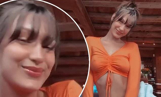 Bella Hadid - Bella Hadid flaunts her taut midriff after she successfully cuts her own bangs during quarantine - dailymail.co.uk
