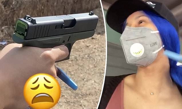 Cardi B masks up to get some outdoor shooting practice and keeps her ultra-long blue nails - dailymail.co.uk
