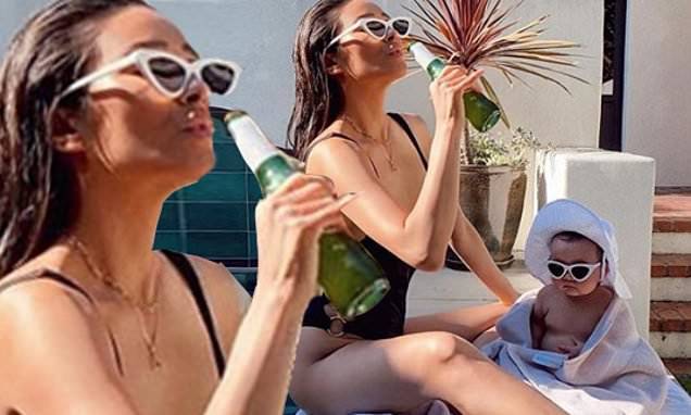 Shay Mitchell - Shay Mitchell drinks a beer while in a swimsuit with her baby daughter Atlas - dailymail.co.uk