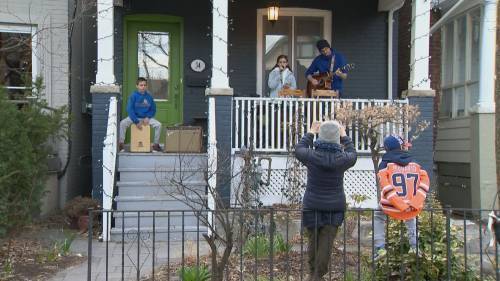 Family in Toronto’s Danforth neighbourhood performs songs to salute frontline workers - globalnews.ca