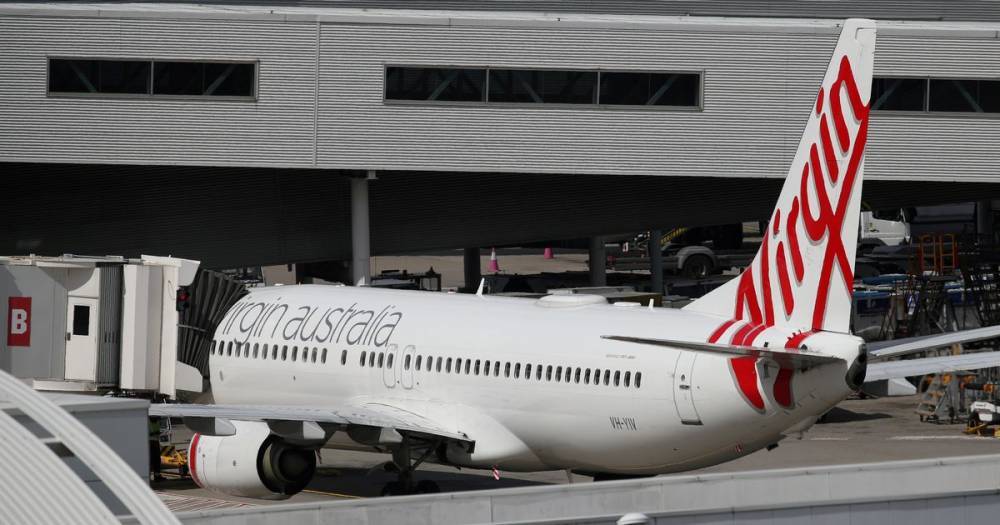 Virgin Australia goes into voluntary administration putting 16,000 jobs at risk - mirror.co.uk - China - Singapore - Australia