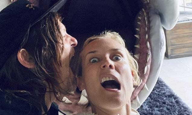 Diane Kruger - Diane Kruger shares funny photo with head in shark's mouth as Norman Reedus takes a bite out of her - dailymail.co.uk
