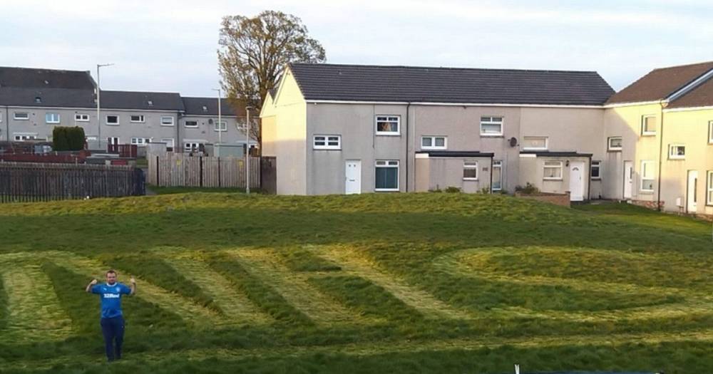 Neighbours mow giant NHS sign into grass in honour of NHS heroes - dailyrecord.co.uk
