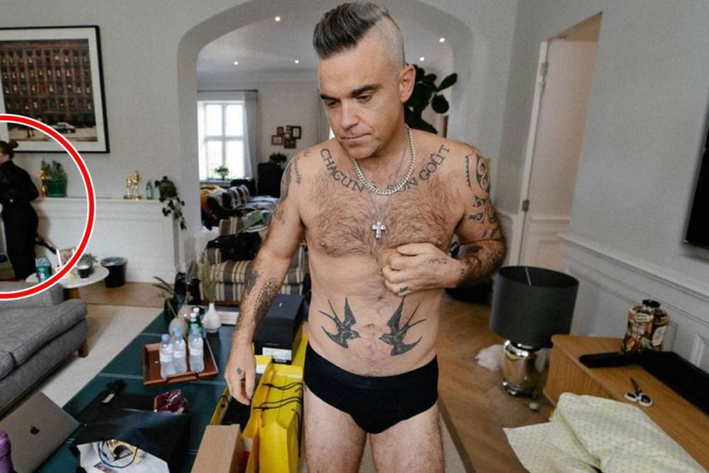 Robbie Williams - Robbie Williams sends fans wild as he wanders around messy house in his pants – in front of the cleaner - thesun.co.uk