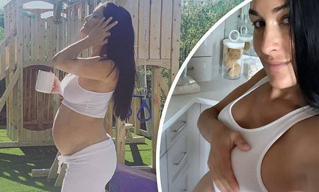 Nikki Bella - Nikki Bella flaunts her growing baby belly as she poses nude at seven-months pregnant - dailymail.co.uk
