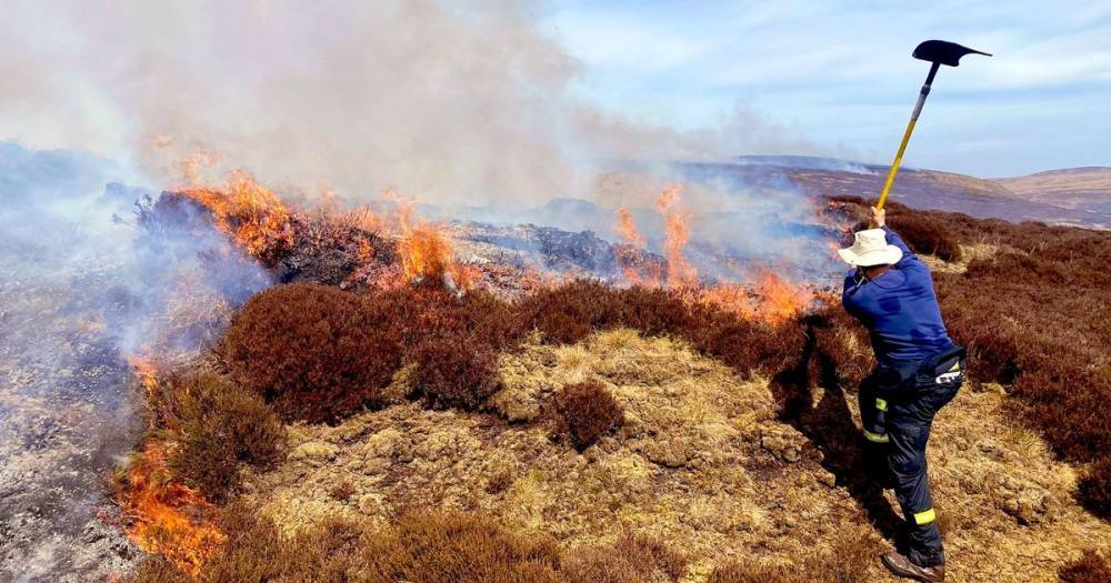 Firefighters continue to tackle moorland fire that has been blazing for nearly 36 hours - manchestereveningnews.co.uk - city Manchester