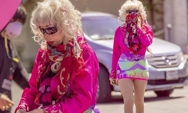 Angelyne proves she's one-of-a-kind as she runs errands wearing silk scarf mask and five-inch heels - dailymail.co.uk