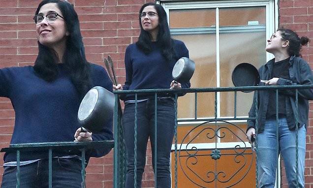 New Yorkers - Sarah Silverman - Annie Segal - Sarah Silverman continues her daily salute of essential workers on fire escape with her assistant - dailymail.co.uk - city Manhattan