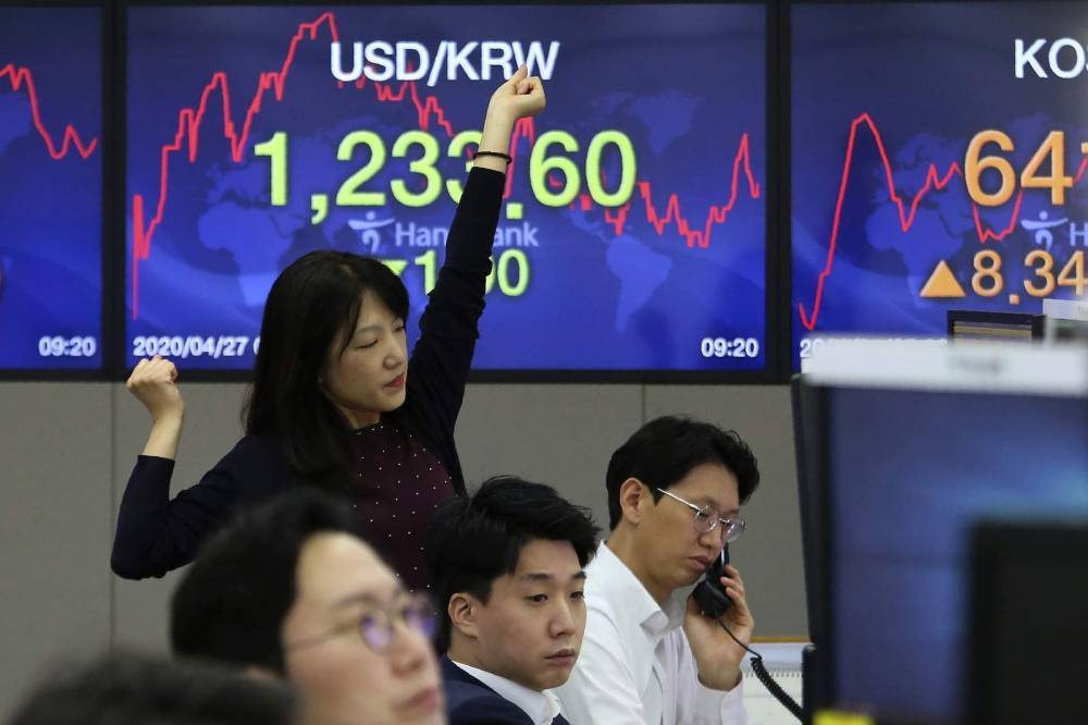 Asian markets gain after Japan central bank boosts aid - clickorlando.com - city Beijing - Japan - city Tokyo - city Shanghai - city Hong Kong