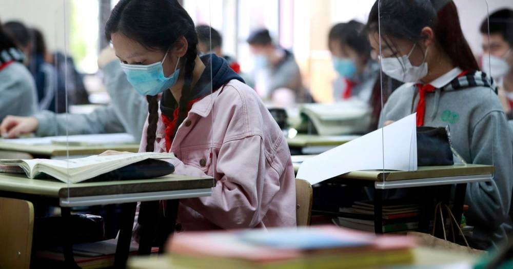 Chinese students go back to school after 100 days of coronavirus lockdown - dailystar.co.uk - China - city Shanghai