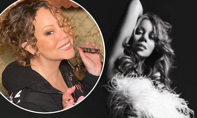 Mariah Carey - Mariah Carey celebrates her album E=MC2 topping the iTunes chart 12 years after its release - dailymail.co.uk